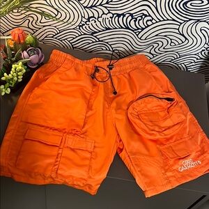 Vibrant Orange Cargo Shorts with Elastic Waistband and Multiple Pockets
